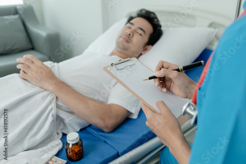Patient on an inpatient hospital bed with a doctor examining and asking for information about the symptoms in order to diagnose the correct and appropriate treatment. The concept of medical treatment.