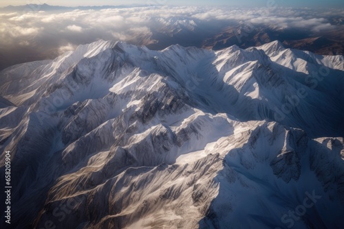 A captivating birds-eye view of a mountain range covered in snow