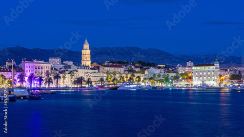 Split, Croatia. Amazing Split city waterfront panorama at night, Dalmatia, Europe. Roman Palace of the Emperor Diocletian and tower of Saint Domnius cathedral. photo
