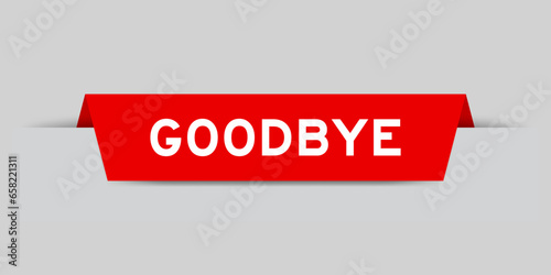Red color inserted label with word goodbye on gray background
