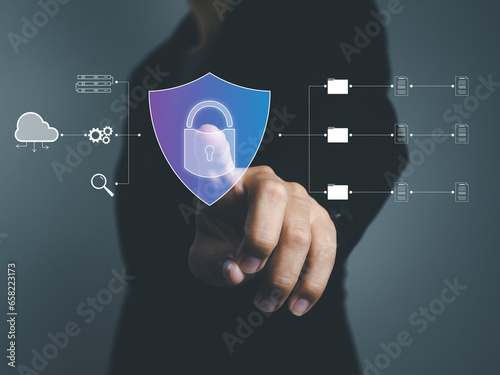 Security privacy on technology cyber, businessman showing a security shield with a padlock to protect business and personal information. on the internet