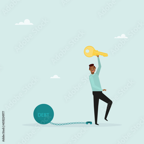 Freedom from debt or freedom to pay off debts, a loan or mortgage, a solution to a financial problem. Happy businessman holding golden key after unlocking debt chain.
