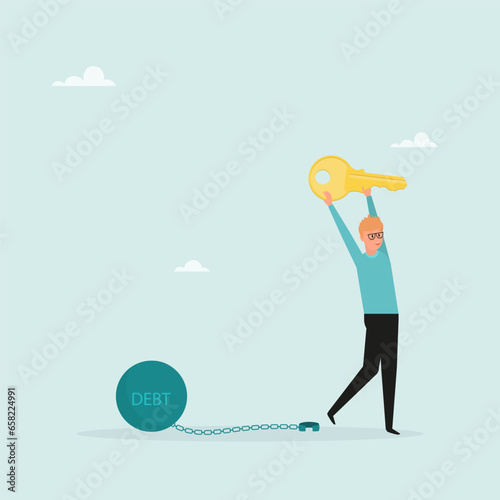 Freedom from debt or freedom to pay off debts, a loan or mortgage, a solution to a financial problem. Happy businessman holding golden key after unlocking debt chain.
