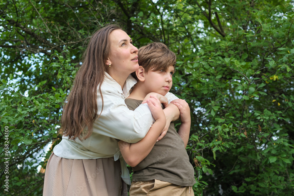Heartfelt moment between mother and son, depicting the warmth of familial love and the consolation of a parent's hug Heartfelt moment between mother and son, depicting the warmth of familial love and the consolation of a parent's hug