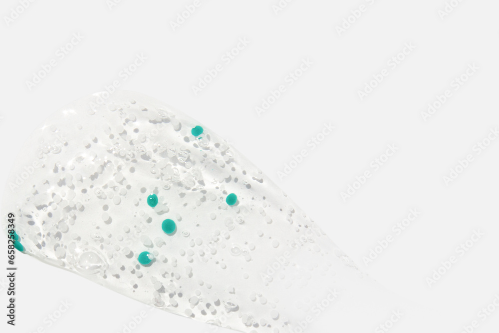 Smear, clear gel with blue granules, serum clear on a white background Smear, clear gel with blue granules, serum clear on a white background