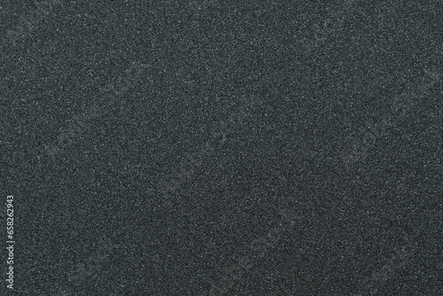 Close up of skateboard grip tape. Macro photograph of sandpaper texture. Skateboarding concept photo