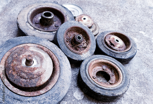 The old black rubber wheels, caster wheel, trolley wheels , demage and corossion  caster wheel. photo