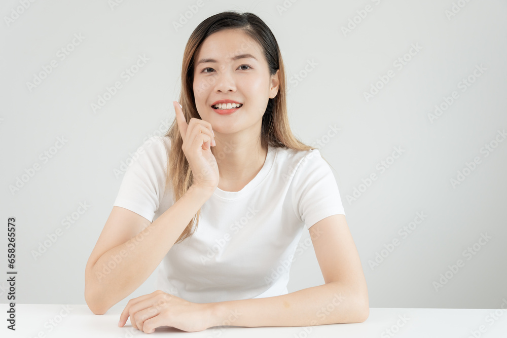 Beautiful Asian woman smile use cream for good skin. face of a healthy woman apply cream and makeup. Advertisement for skin cream, anti-wrinkle, baby face, whitening, moisturizer, tighten pores serum Beautiful Asian woman smile use cream for good skin. face of a healthy woman apply cream and makeup. Advertisement for skin cream, anti-wrinkle, baby face, whitening, moisturizer, tighten pores serum