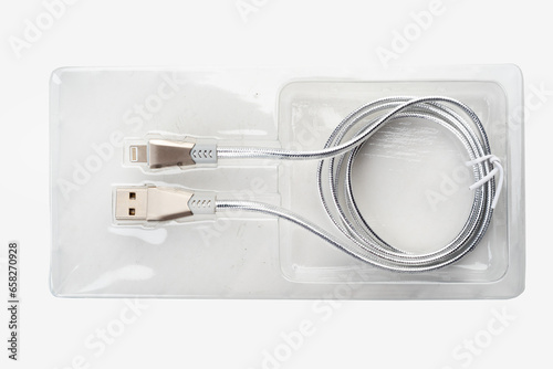Silver-colored USB cable in plastic packaging on a white background.