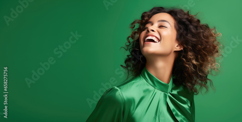 Woman expressing pure elation against a bright green background - Burst of happiness - Studio Shot - AI Generated