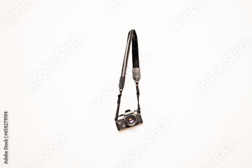 Old film still camera hanging isolated white background