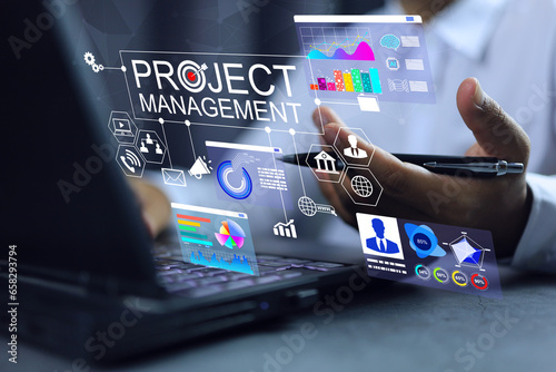 Project management concept manager working on laptop to contact with internal external department search new idea development. Including budget control of available resources for maximum efficiency.