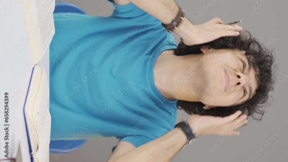 Vertical video of Young man disturbed by noise. Vertical video of Young man disturbed by noise.
