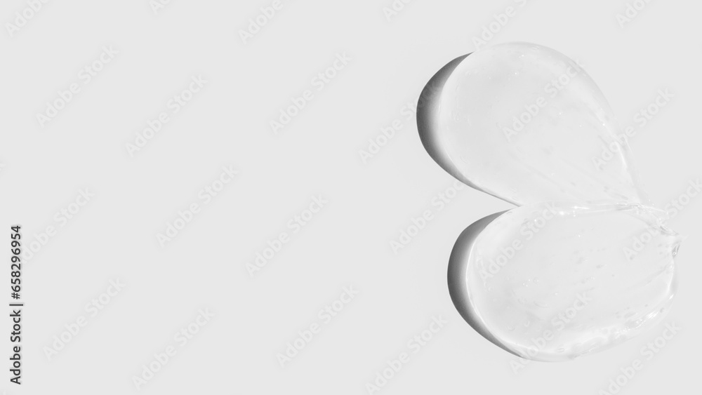 Composition of smears and drops or drops of transparent gel, serum. On a light background. Composition of smears and drops or drops of transparent gel, serum. On a light background.