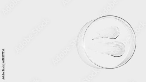 Petri dish on a light background, transparent gel smears. Empty place