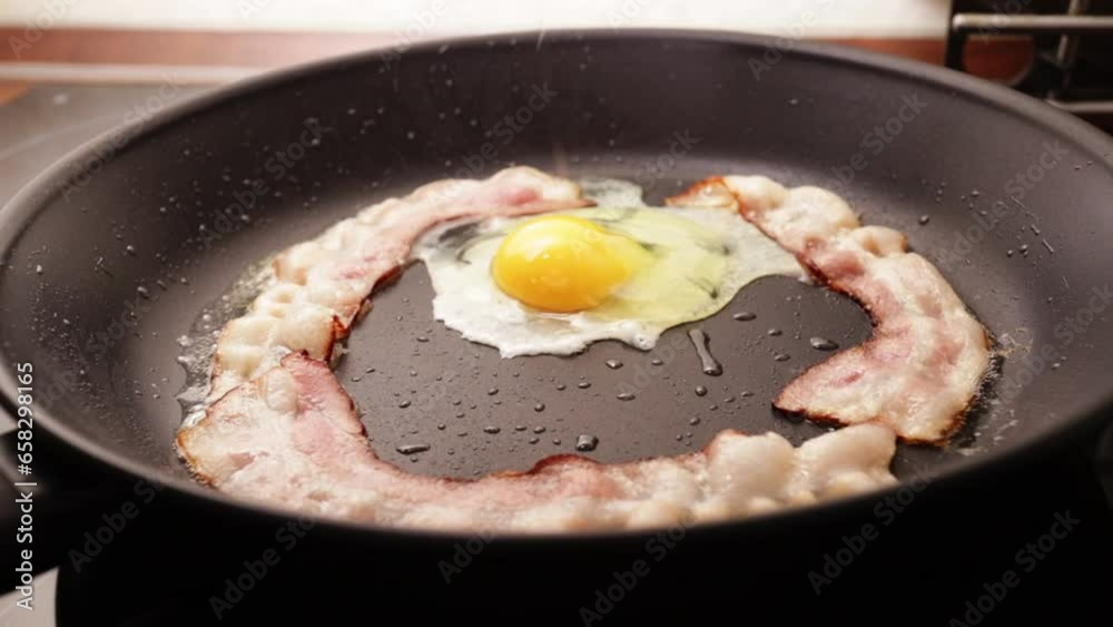 Crispy bacon cooked in a skillet,morning meal Crispy bacon cooked in a skillet,morning meal