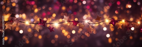 Holiday illumination and decoration concept - christmas garland bokeh lights over red, burgundy or wine shaded background banner, stars, baubles and decoration for x-mas