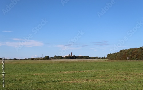 Lighthouse and Schinkelturm in a distance on Cape Arkona on the Baltic Sea island of Ruegen photo