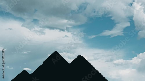 Giza Pyramids at Egypt with a blue cloudy sky in a sunny day