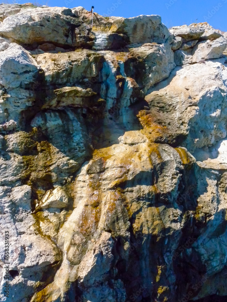 Water containing hydrogen sulfide separated from extracted oil flows into the Black Sea along a steep bank