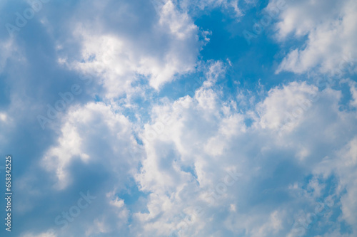 Beautiful cloudy blue sky. Fluffy clouds in the sky. Cloudy weather.