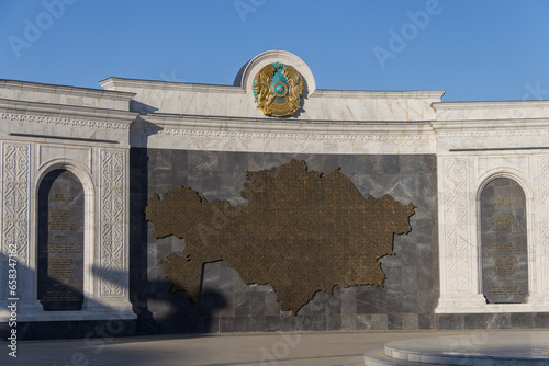 Atyrau, Kazakhstan (Qazaqstan), 03.09.2023 - State symbols of the Republic of Kazakhstan - Coat of arms, Anthem and map of the Republic of Kazakhstan