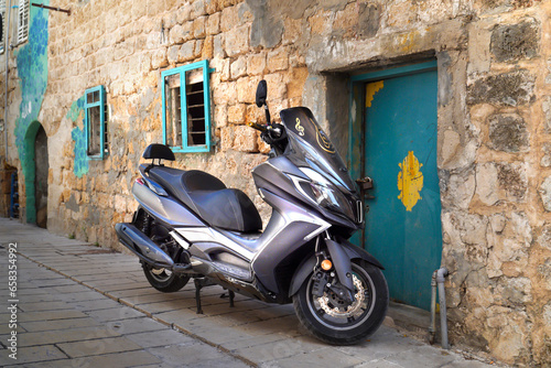 Streets of the old town, tourist attraction, motorbike and electric bike rental