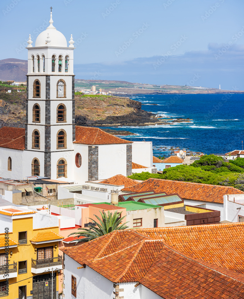 View of the bell tower of the Church of Santa Ana (Iglesia de Santa Ana) and residential buildings of the small town of Garachico on the northern coast of Tenerife. Canary Islands. Spain.