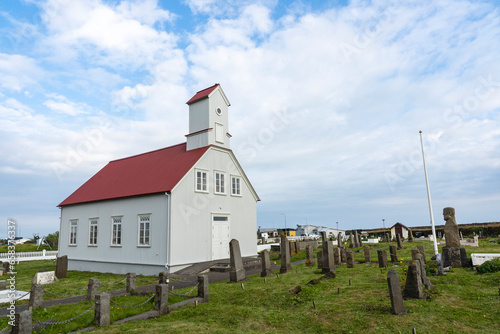 The village church in the town of Eyrarbakkakirkja (1890), Iceland with graveyard. 