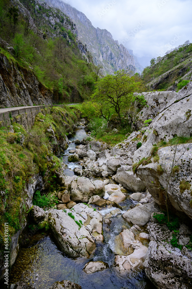 Driving narrow mountain road from Los Arenas to remote mountain village Sotres, Picos de Europa mountains, Asturias, North of Spain