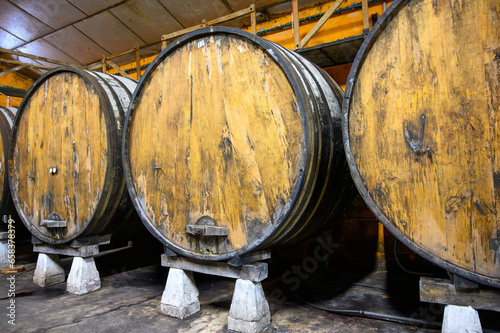 Making of traditional natural Asturian cider made from fermented apples in barrels for several months should be poured from great height, allowing lots of air bubbles into the drink. photo