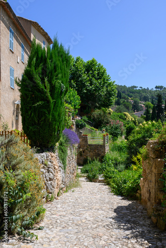 Travel destination, small ancient village Cotignac in Var, Provence, surrounded by vineyards and cliffs with troglodytes houses.