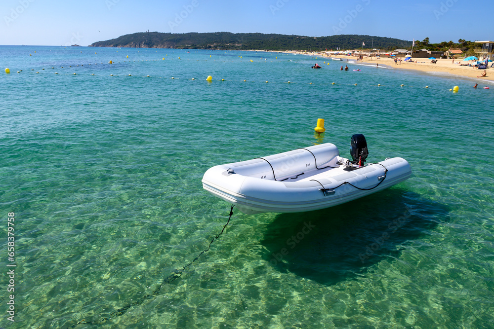 Crystal clear blue water of legendary Pampelonne beach near Saint-Tropez, summer vacation on white sandy beach of French Riviera, France