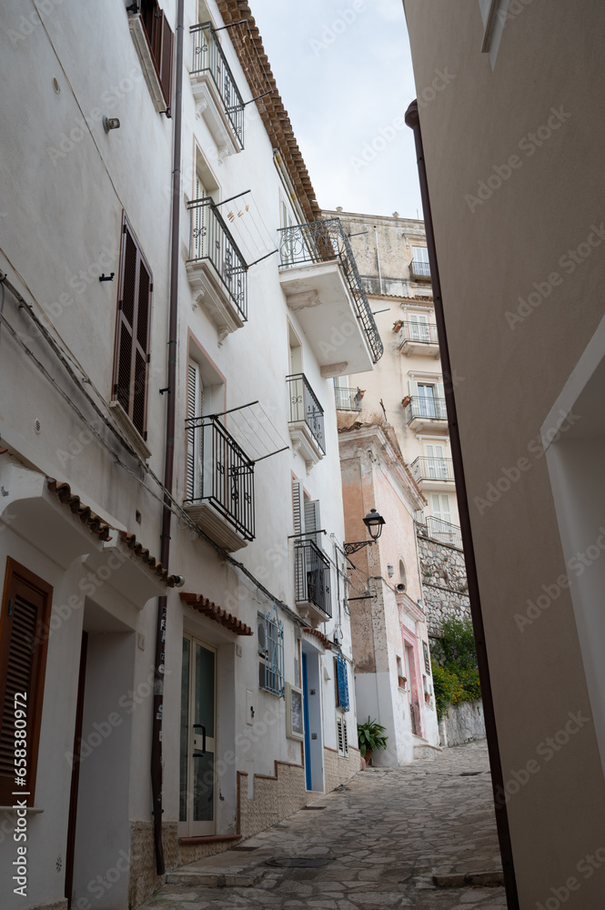 White stairs and old houses in medieval small touristic coastal town Sperlonga, Latina, Italy on sunrise in summer