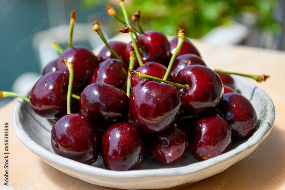 New harvest of fresh ripe dark red cherry berry in Provence, France close up New harvest of fresh ripe dark red cherry berry in Provence, France close up