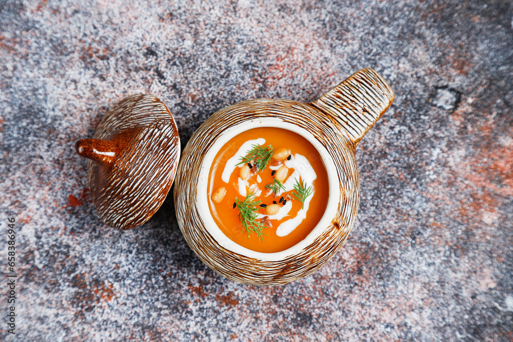Fototapeta premium Traditional autumn butternut squash soup with seeds.