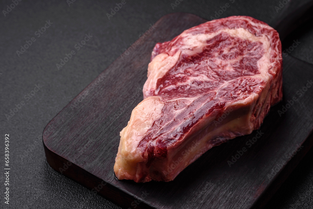 Fresh juicy raw beef striploin steak with salt and spices Fresh juicy raw beef striploin steak with salt and spices