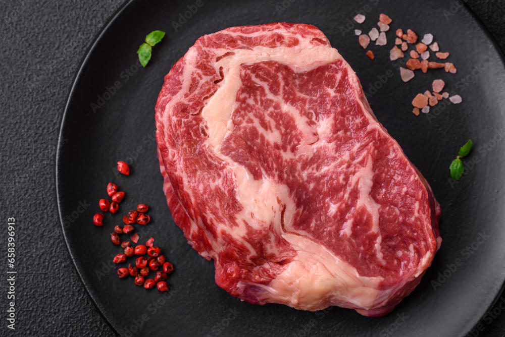 Fresh juicy raw beef striploin steak with salt and spices Fresh juicy raw beef striploin steak with salt and spices