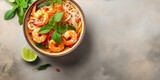 Laksa Shrimp bowl. glass noodle dish, top view, copy space. Asian Malaysian food with shrimps, bok choy, lime, ginger, and chili. Most variations of laksa are prepared with spicy cocon : Generative AI