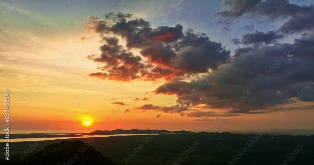 .There is a golden yellow glow on the horizon caused by the radiant light of the sun..colorful sky of sunset sunrise 4K Shooting with Drone. Gradient color..clouds move over the sea in golden sunset .There is a golden yellow glow on the horizon caused by the radiant light of the sun..colorful sky of sunset sunrise 4K Shooting with Drone. Gradient color..clouds move over the sea in golden sunset