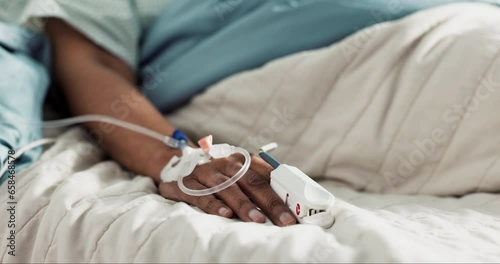 Patient, iv drip and hospital bed for treatment in hand, healthcare and medicine for wellness. Person, medicare and intravenous medication or infusion of morphine, icu and emergency or recovery