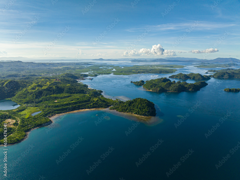 Tropical islands and blue sea. Blue sky and clouds. Mindanao, Philippines. Seascape.