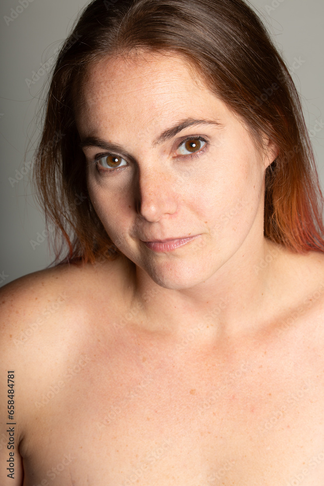 A sallow, unhealthy woman in her 30s wearing a blue bathrobe, conveying self-care, wellness, and relaxation, ideal for health-related content. A sallow, unhealthy woman in her 30s wearing a blue bathrobe, conveying self-care, wellness, and relaxation, ideal for health-related content.