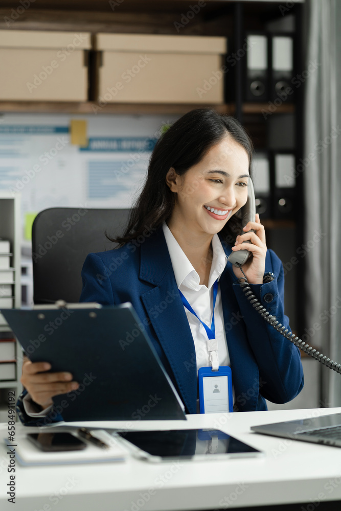 Business women talk mobile phones and working on laptop computers, online business, work from home, teleworking concept. Business women talk mobile phones and working on laptop computers, online business, work from home, teleworking concept.