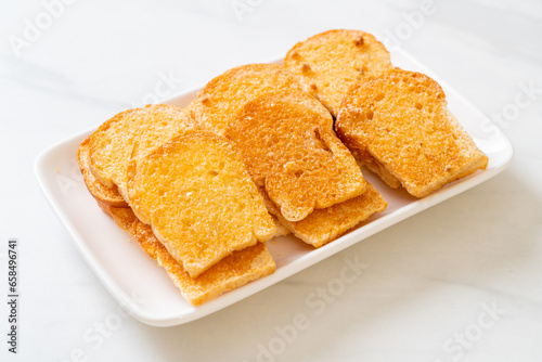 baked crispy bread with butter and sugar