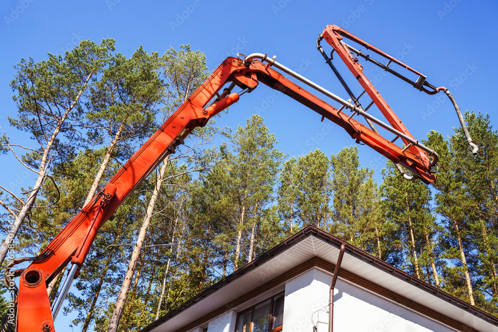 modern Truck Concrete Pump, New technology house building, Construction,  Concrete pouring during commercial concreting  in construction site