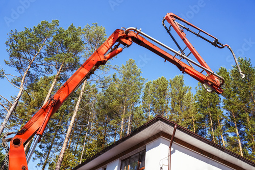 modern Truck Concrete Pump, New technology house building, Construction, Concrete pouring during commercial concreting in construction site