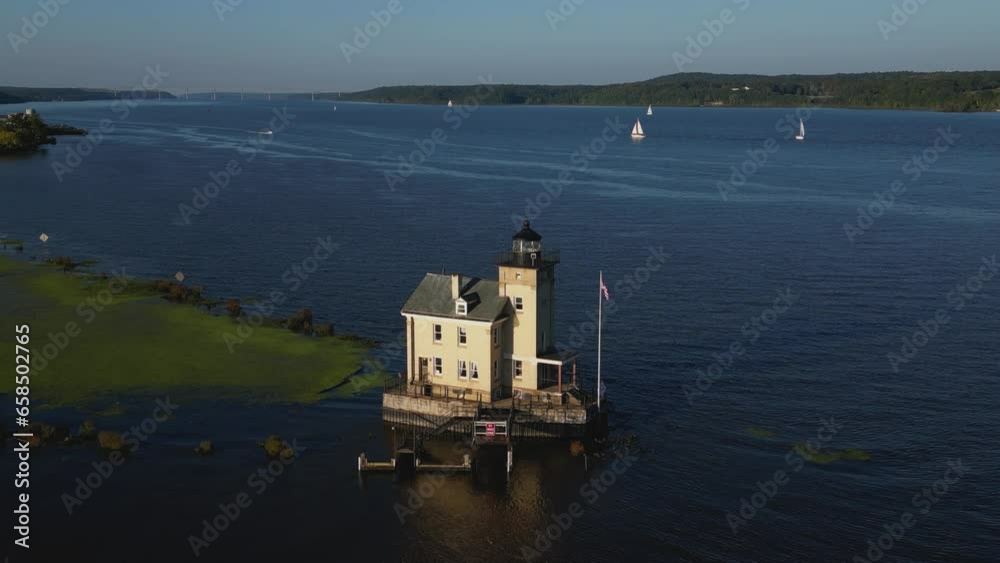 Aerial view of old lighthouse at sunset, drone 4K Aerial view of old lighthouse at sunset, drone 4K