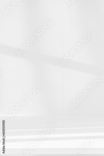 Fototapeta Naklejka Na Ścianę i Meble -  Empty white desk with morning light and shadows of windows with copy space, summer concert. Blurred backdrop abstract background for display product.