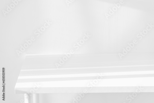 Wallpaper Mural Empty white desk with morning light and shadows of windows with copy space, summer concert. Blurred backdrop abstract background for display product. Torontodigital.ca